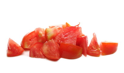 Tomato slices, chunks pile isolated on white background