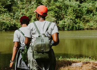 Two young women with backpack on a hike in Pugu hills in Kisarawe Tanzania