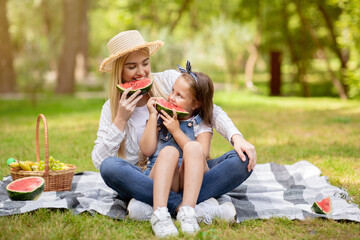 Happy Mother And Kid Girl Eating Watermelon Enjoying Day Outside