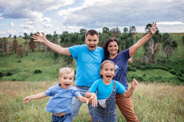 Crazy family portrait. Parents with two kids making selfie during local travel