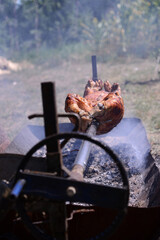 Pig on a skewer, a way of preparing food for more people