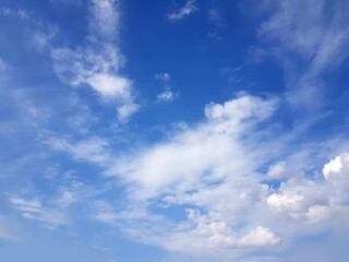 Naklejka na ściany i meble Blue sky clouds background. Beautiful landscape with clouds