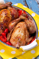 Whole baked chicks with lemon, paprika and cayenne pepper