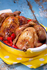 Whole baked chicks with lemon, paprika and cayenne pepper