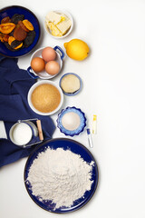 Traditional Russian Easter cake ingredients: flour, yeast, sugar, lemon, milk, eggs, butter, dried fruits, marzipan, vanilla and rum extract