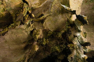 Hike to the cave. Ancient stone cave stalactites and stalagmites