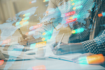 Businessman with computer background with technology theme hologram. Concept of hightech. Multi exposure.