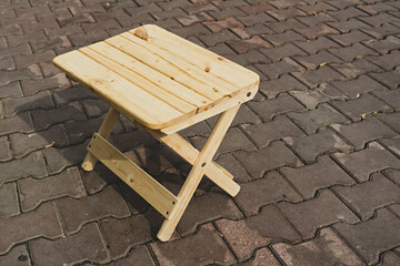 Folding wooden stool