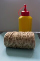 Brush, glue, twine composition