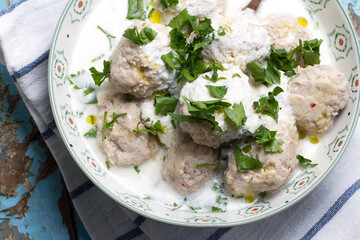 Turkey meatballs with cheese-garlic sauce and parsley