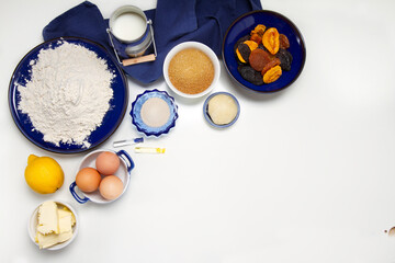 Traditional Russian Easter cake ingredients: flour, yeast, sugar, lemon, milk, eggs, butter, dried fruits, marzipan, vanilla and rum extract