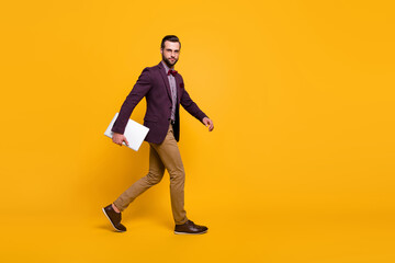 Full length profile photo of handsome rich clothes stylish guy well-dressed business man walk meeting hold notebook wear plaid shirt blazer trousers shoes isolated yellow color background