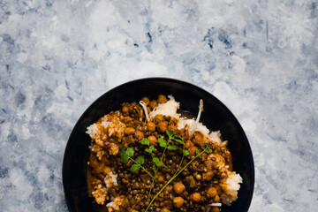 plant-based food, vegan rice and beans with mexican spices and cilantro topping