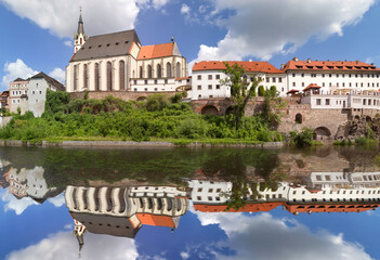 Fototapeta na wymiar St. Vitus Church and former jesuit college. Cesky Krumlov, Czech republic