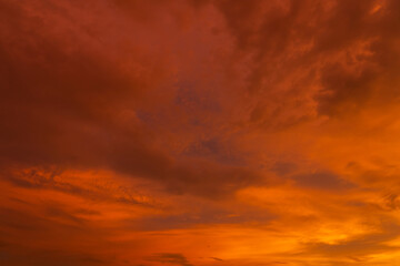 unusually beautiful fiery red tropical sunset. Burning clouds. Fire in the sky