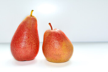 Two red pears on a white background