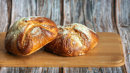 Baked sweet buns on a wood table
