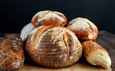 Various of baked bread on wooden table background