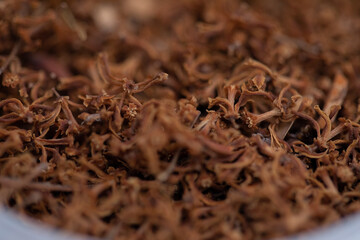 close up of dried neem flower used in cuisine and as medicine in india