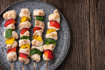 space bbq chicken stick with bell pepper on wood