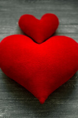 Two red hearts,big and small together. Mutual love.