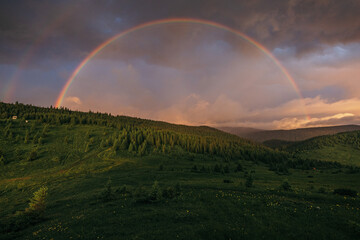 Fototapeta na wymiar A rainbow over a field
