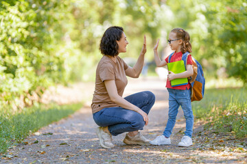 Parent and pupil go to school