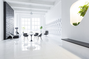 Luxurious futuristic trendy modern interior in contrasting black and white colors with interesting fashionable black furniture and decorated wall