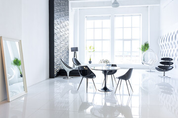 Luxurious futuristic trendy modern interior in contrasting black and white colors with interesting fashionable black furniture and decorated wall