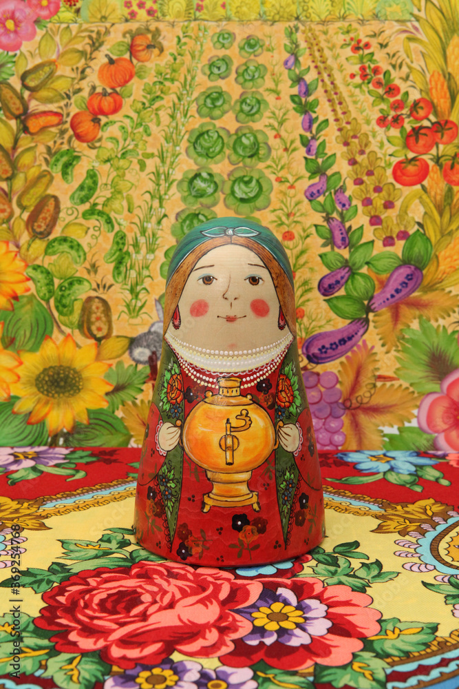 Wall mural Russian traditional wooden nested doll, matryoshka, woman in national costume with samovar. Pavlovo Posad shawl. Russian style in folk art, ethnic handcraft, slavic craft