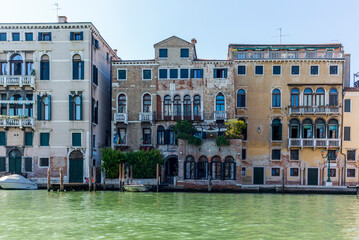 The entrances on the water channels of the old palaces in Venice, as seen from a gondola