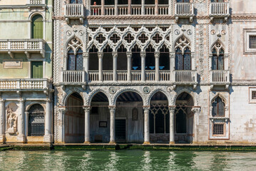Naklejka premium The entrances on the water channels of the old palaces in Venice, as seen from a gondola