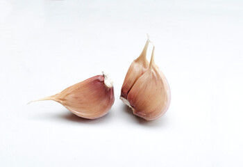 Closeup of juicy fresh and raw garlic on the white surface