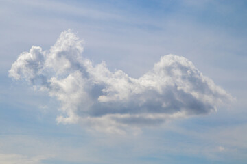Fototapeta na wymiar single cloud in the blue sky