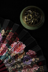 still life in Chinese style. incense burner and isolated on black background