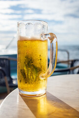 Cold Beer on a beach in big glass