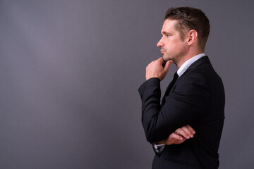 Portrait of handsome bearded businessman in suit