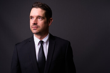 Portrait of handsome bearded businessman in suit