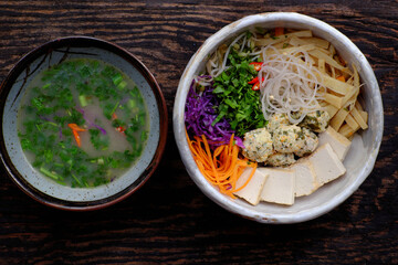 Homemade Vietnamese vegan noodles soup, colorful vegetables, tofu balls, delicious, nutrition, healthy vegetarian dish bowl
