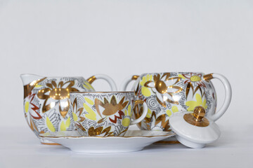 Set of tea service from a teapot and Cup on a saucer