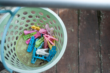 Plastic clothes pins in the bucket Plastic clothes pin in the bucket