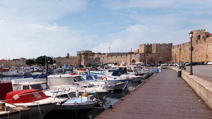 Rhodes, embankment and boats in Mandraki harbour, Rhodes, Greece