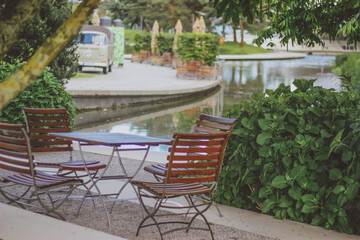 Fototapeta premium river in the park, summer cafe in the park by the river