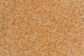 Brown graveled wall. Mixed mineral and rock texture
