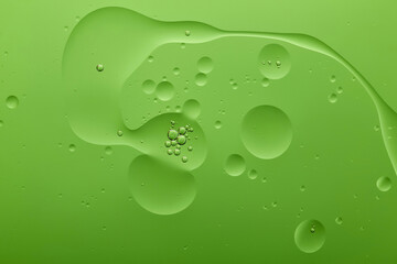Current collection of brilliant backgrounds for your design. Close-up shot of silver bubbles in water spots on green surface.