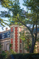 Vertical picture of old stone chateau, vineyard in french, in Chateauneuf-du-Pape, famous wine province in Provence, France. Travel tourism destination