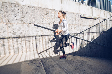 Athletic woman training in the urban area.