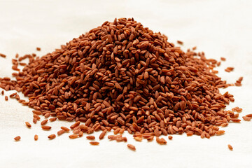 Uzbek rice devzira of red-brown color, intended for the preparation of pilaf.