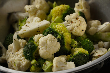 Steamed cruciferous vegetables - broccoli and cauliflower with sprinkle of black pepper. Living healthy lifestyle. 