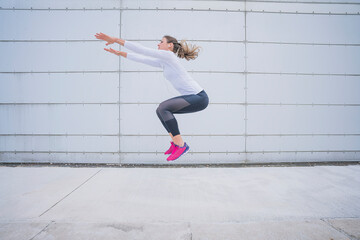 Athletic woman training in the urban area.